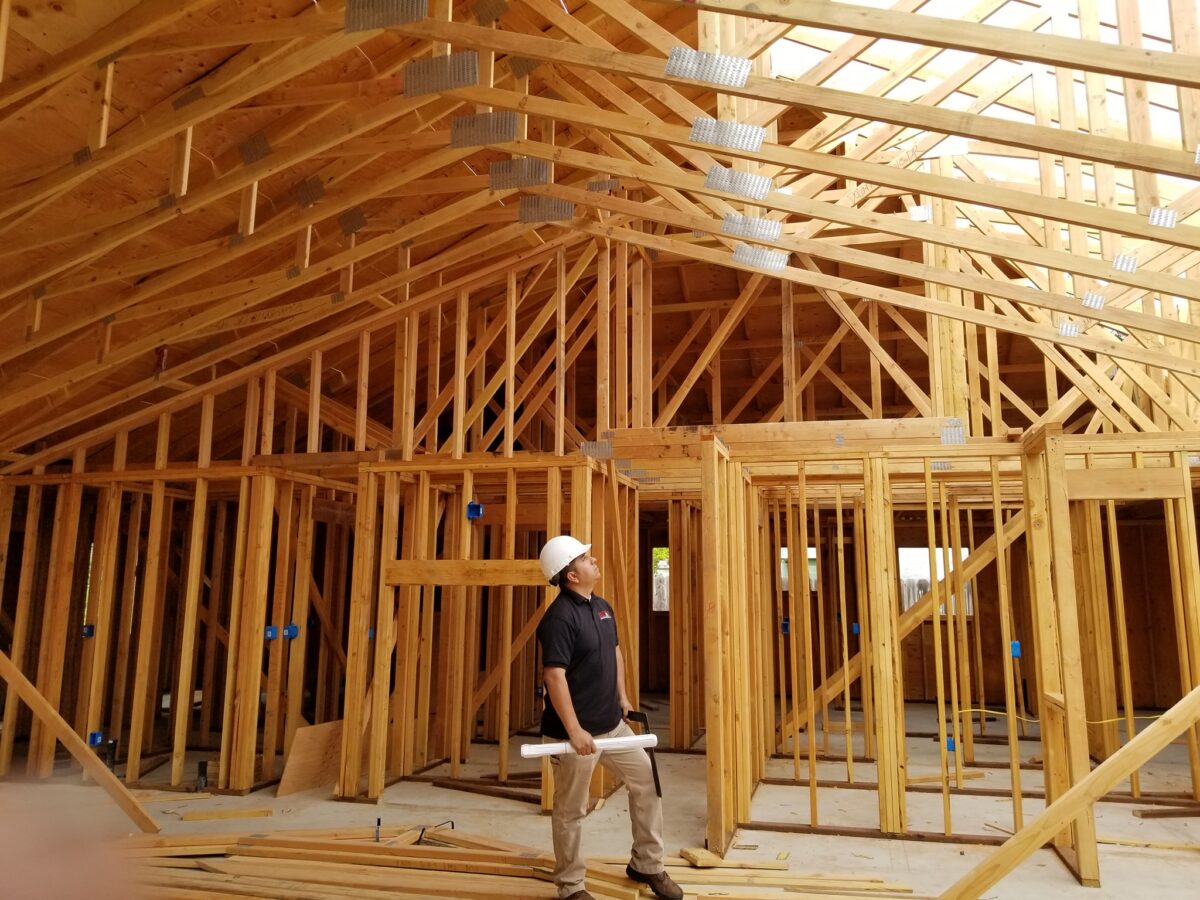 Exposed wood wall framing and roof framing during residential construction