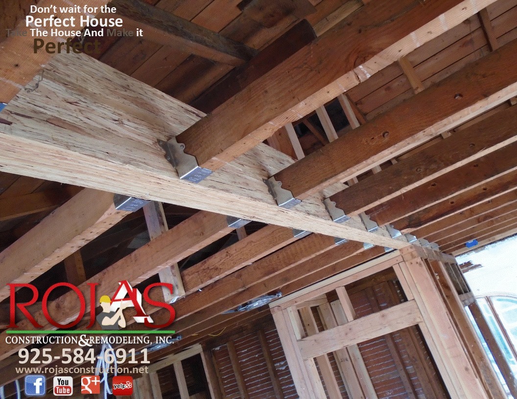 Wood structural beam and exposed ceiling framing during construction