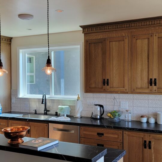 https://www.rojasremodel.com/wp-content/uploads/2026/10/Kitchen-–-Wood-Cabinets-and-Pendant-Lighting-540x540.jpg